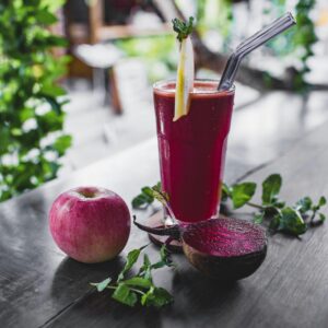 Refreshing beetroot and apple juice garnished with mint leaves, perfect for a healthy detox.